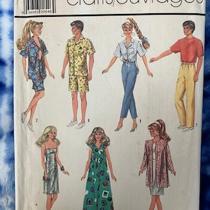 May include: A sewing pattern for making clothes for 11.5 inch or 12 inch dolls. The pattern includes instructions for making a dress, a skirt and top set, a jumpsuit, a jacket, and a pair of pants. The pattern is from Simplicity and has the number 7928 on it.