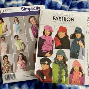 May include: Two sewing pattern books, one for Simplicity pattern 2170 and one for McCall's Fashion Accessories pattern M5773. The Simplicity pattern shows a variety of women wearing different scarves. The McCall's pattern shows women wearing hats and scarves.