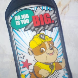 May include: A white and blue cartoon character with a yellow hard hat and a brown body. The character is a dog with a black nose and brown eyes. The character is standing on a white background with blue and white stripes. The character is holding a yellow tool belt. The text "NO JOB IS TOO BIG." is in a green speech bubble above the character.