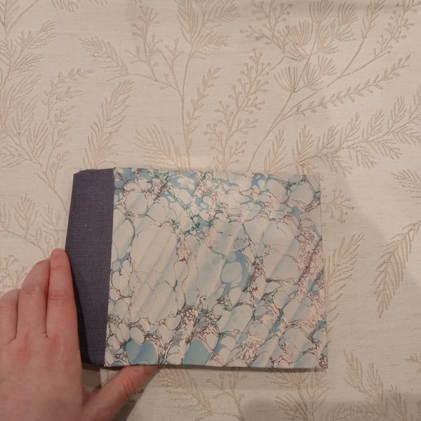 Imperfect A5 landscape cotton rag watercolour sketchbook. Printed marbled cover.