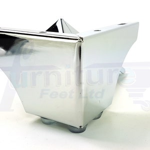 May include: Chrome corner furniture leg with a triangular top and four round feet.