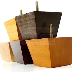 May include: Four wooden furniture legs in different shades of brown and natural wood. The legs are square with a beveled edge and have a threaded metal screw for attaching to furniture.