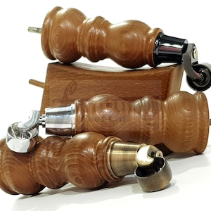 May include: Wooden furniture legs with castors. The legs are a warm brown colour, with a turned design. The castors have metal accents in black, silver, and bronze. The legs are designed to be screwed into a piece of furniture.