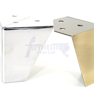 May include: Two metal furniture legs, one in polished chrome and one in brushed brass. Both legs are triangular in shape and have a slight angle.