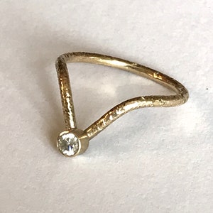 A 9ct gold wishbone ring set with a sparkling Moissanite diamond size J or 4 3/4