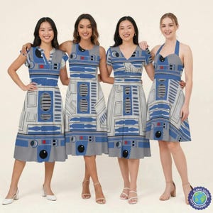 May include: Four women wearing dresses with a blue, gray, and white design. The dresses have a similar pattern, with variations in neckline and sleeve style. The dresses feature a design reminiscent of a popular science fiction character.