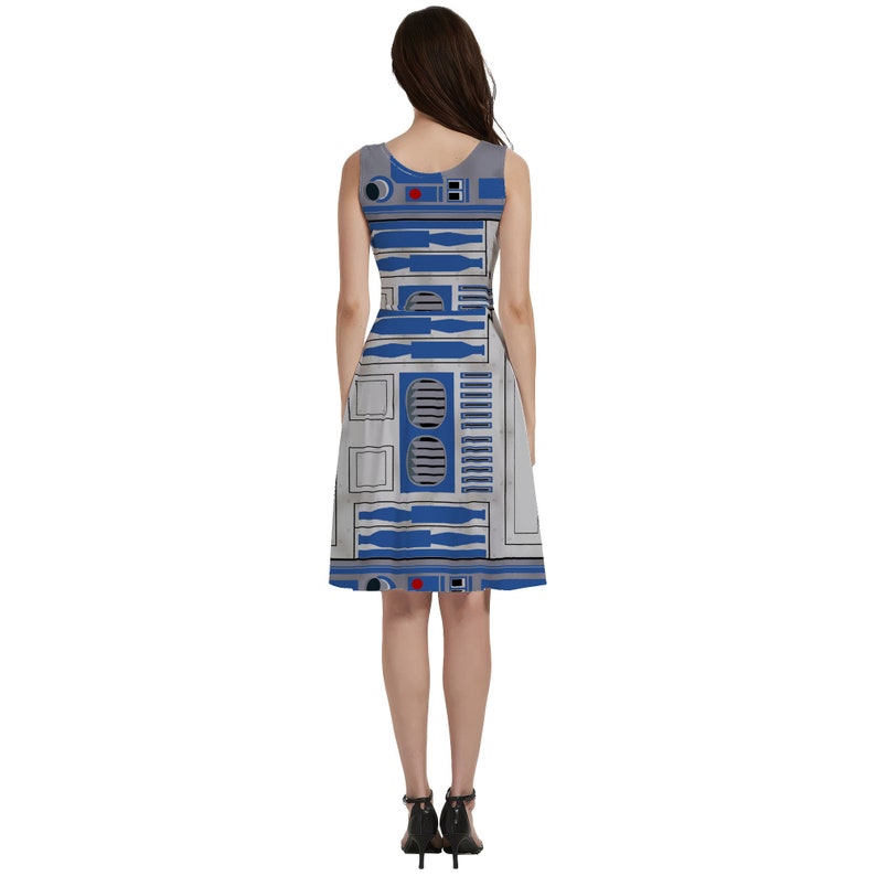 a woman wearing a dress with a robot pattern