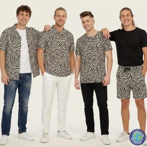May include: A collection of clothing featuring a black and white zebra print pattern. The items include a short-sleeved button-down shirt, a crew-neck t-shirt, and a pair of drawstring shorts, all displayed alongside solid white and black garments.