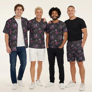 May include: A collection of apparel featuring a dark fabric with a repeating pattern of purple and blue stylised figures. The set includes a short-sleeved button-down shirt, a polo shirt, a crew-neck t-shirt, and a pair of elastic-waist shorts.