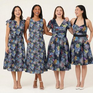 May include: Four dresses featuring a dark blue space-themed print with planets, stars, and lightsabers. The styles include a flutter-sleeve dress, a sleeveless A-line dress, a V-neck short-sleeve dress, and a halter-neck dress with a black waistband.