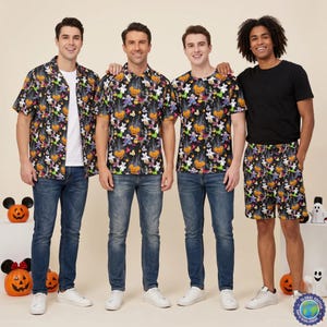 May include: Four individuals wearing clothing with a black background featuring a repeating Halloween pattern of orange pumpkins, white ghosts, and colourful skeletons. The garments include short-sleeved button-down shirts, a t-shirt, and shorts.
