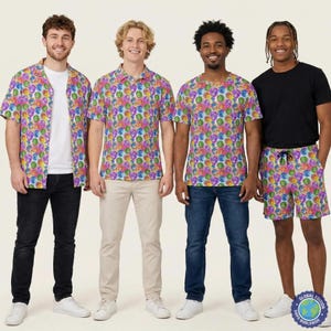 May include: Four people modelling colourful patterned shirts, shorts, and trousers. The shirts and shorts feature a repeating design of colourful circles. One person wears a black t-shirt and shorts with the same pattern. White trainers complete the outfits.