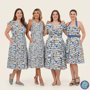 May include: Four knee-length dresses featuring a light blue and white horizontal striped pattern with a repeating print of Disney characters including Mickey Mouse, Minnie Mouse, and Pluto, with varying necklines and sleeve styles.