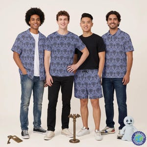 May include: Four individuals wearing clothing with a purple and black damask-style wallpaper pattern. The attire includes a short-sleeved button-down shirt, a t-shirt, and shorts. Also visible are a metal key, a bat-topped stand, and a small plush figure.