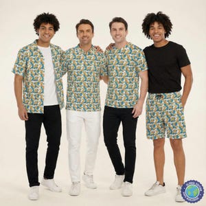 May include: Four outfits featuring a repeating pattern of yellow cartoon characters on a teal background. The collection includes a short-sleeved button-down shirt, a polo shirt, a crew-neck t-shirt, and a pair of shorts, paired with black or white trousers.