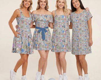Puede incluir: Cuatro vestidos de tela gris claro con un patrón colorido y repetitivo de varios iconos, incluyendo orejas de Mickey Mouse, arcoíris y monumentos de parques. Los vestidos varían en estilo, incluyendo cortes sin mangas, con hombros descubiertos y manga corta.