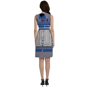 a woman in a dress with a robot on it