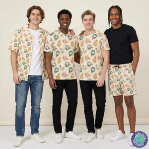 May include: Four individuals wearing clothing featuring a repeating pattern of circular ornaments containing cartoon characters. The garments include a short-sleeved button-down shirt, a polo shirt, a crew-neck t-shirt, and shorts, paired with jeans.