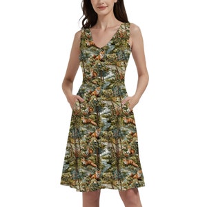 May include: A sleeveless dress with a V-neckline and a forest scene print featuring foxes, trees, and flowers. The dress has pockets on both sides and a flared skirt.