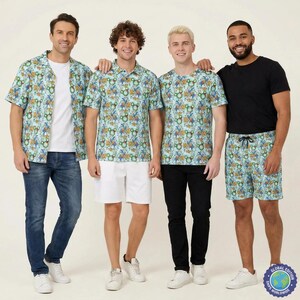 May include: A collection of apparel featuring a light blue fabric with a repeating pattern of green Mickey Mouse silhouettes and colorful tropical floral motifs. The set includes a short-sleeve button-down shirt, a polo shirt, a t-shirt, and shorts.
