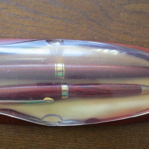 Set of pens with an iridium spring and a roll of pen in original box
