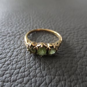 9 ct gold UK ring with three large peridot gemstones
