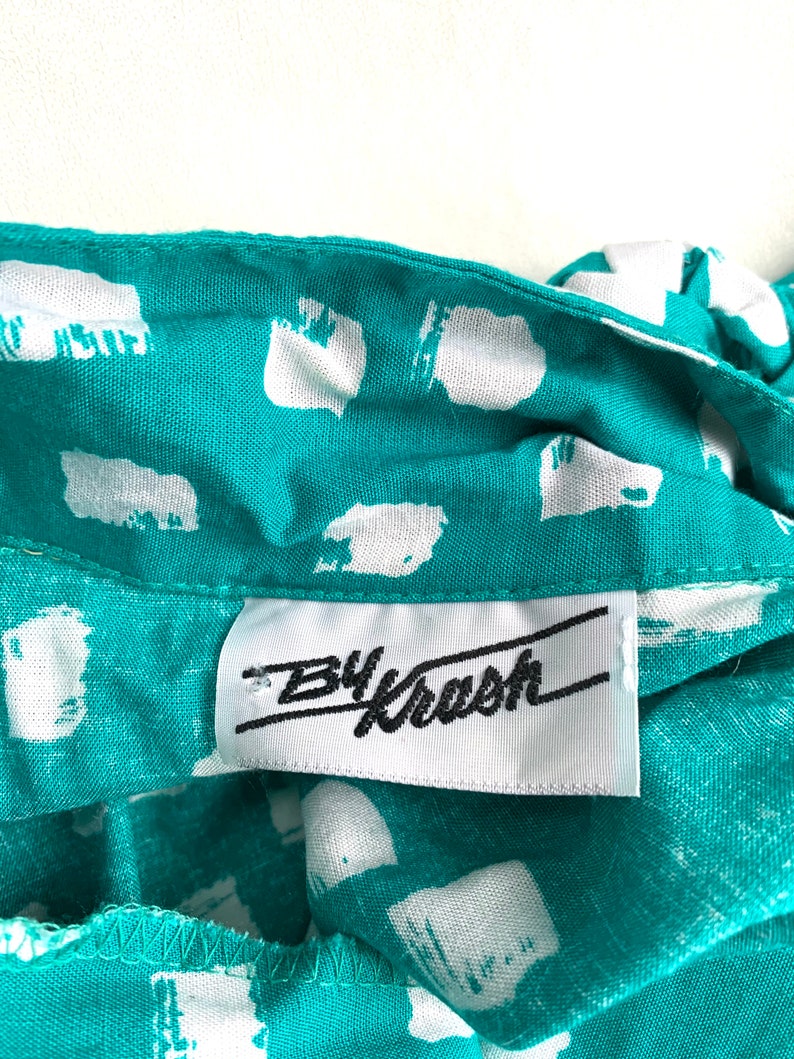 Vintage 80s jumpsuit by Krash short sleeve Medium 6 shoulder pads button up blue green white dotted squares grid one piece 1980s rayon