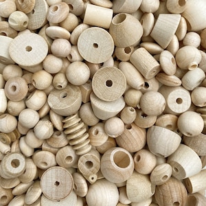 May include: A large collection of natural wood beads and shapes in various sizes. The beads and shapes are all made of unfinished wood and have a natural, rustic look.