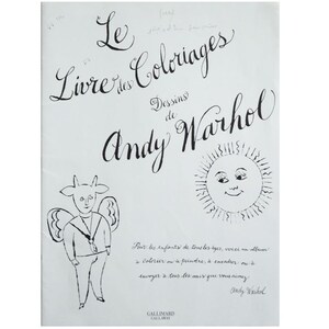 May include: A black and white illustration of a book cover titled "Le Livre des Coloriages Dessins de Andy Warhol." The cover features whimsical drawings of a sun, an angel-like figure, and handwritten text.
