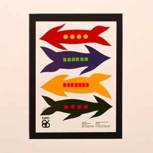 May include: A framed poster with four colourful arrows in red, purple, orange, and dark green. Each arrow has a different number of coloured dots or squares. The poster includes the text "EXPO 86" and additional text at the bottom.