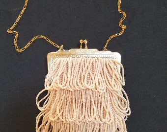 The "Annie Hatton" style purse, bead knit in off white, framed and fully lined and with gold frame and chain