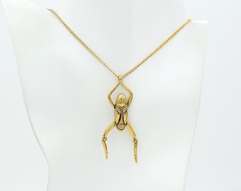 Vintage 70s Articulated Figure Pendant Necklace • Gold Tone Mask • R.I. Bead & Comp