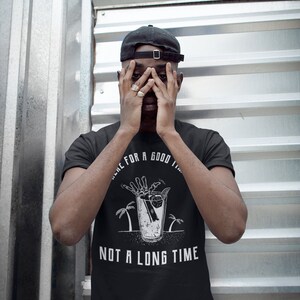 May include: Black t-shirt with a white graphic of a skeleton hand reaching into a glass of ice with a lemon wedge. The text "Time for a good time, not a long time" is printed below the graphic.