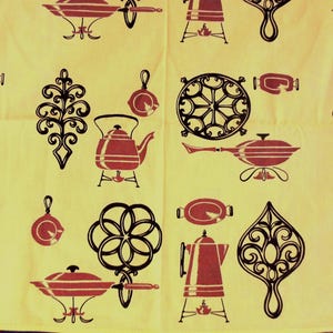 May include: A yellow fabric with a repeating pattern of red and black kitchen-themed illustrations. The design includes kettles, pans, and decorative elements. The fabric has a vintage aesthetic.