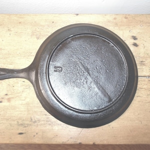 May include: A set of three ceramic mugs with a speckled, matte finish. The mugs are in shades of cream, light gray, and dark gray. Each mug has a simple, minimalist design, perfect for coffee or tea.