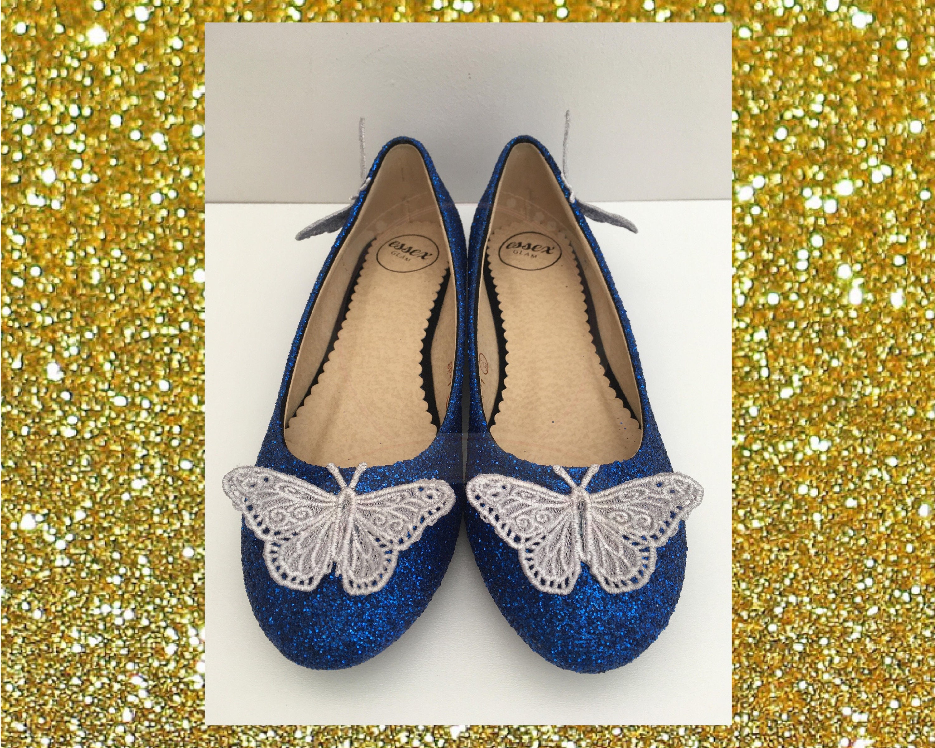 white shoes with blue butterflies