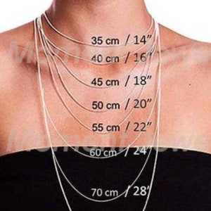 May include: Necklace length guide featuring multiple silver chains of varying lengths. Measurements are displayed in both centimeters and inches: 35 cm/14", 40 cm/16", 45 cm/18", 50 cm/20", 55 cm/22", 60 cm/24", and 70 cm/28".