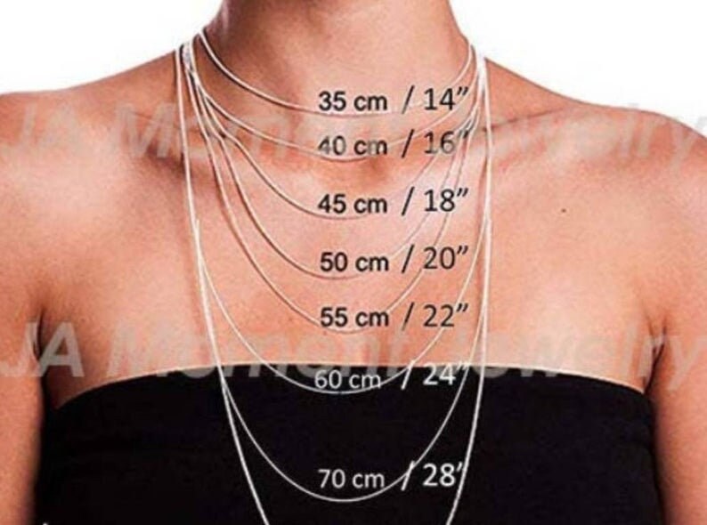 May include: Necklace length guide featuring multiple silver chains of varying lengths. Measurements are displayed in both centimeters and inches: 35 cm/14", 40 cm/16", 45 cm/18", 50 cm/20", 55 cm/22", 60 cm/24", and 70 cm/28".