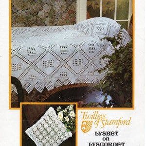May include: A white crocheted throw blanket with a diamond pattern and a crocheted pillow with a floral design. The image includes the text "Twilleys of Stamford Lysbet or Lysgordet Home Crochet".