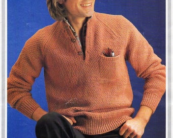 May include: A brown knitted sweater with a button-up collar and a pocket on the left side. The sweater is being modeled by a person with blonde hair. The text "Hayfield 1547 DK" is visible in the top right corner of the image.