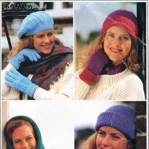 May include: Four women wearing different knitted hats and gloves. The hats are in blue, purple, pink and light blue. The gloves are in purple, blue and light blue.
