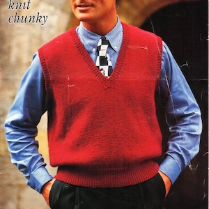 May include: A red knitted vest with a V-neck and a ribbed bottom. The vest is worn over a blue button-down shirt with a black and white checkered tie. The text "4 ply aran double knit chunky" is visible in the top left corner of the image.