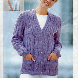 May include: A purple knitted cardigan with a cable knit pattern and pockets. The cardigan has a V-neck and buttons down the front.