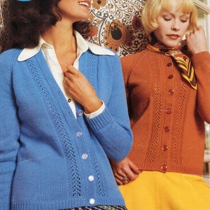 May include: Two women wearing knitted cardigans with button fastenings. The cardigan on the left is blue and the cardigan on the right is orange. Both cardigans have a lacy pattern. The woman on the left is wearing a plaid skirt and the woman on the right is wearing a yellow skirt. The image includes the text "c 5509 32-38".