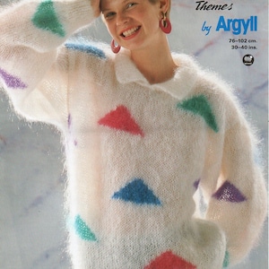 May include: A white mohair sweater with a geometric pattern of colorful triangles. The sweater is 30-40 inches in length and 76-102 cm in circumference. The pattern is called "Deluxe Mohair Themes by Argyll".