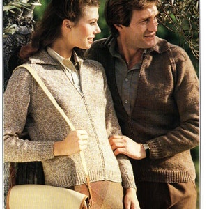 May include: A couple wearing brown knitted sweaters. The woman is wearing a beige satchel bag with a long strap. The man is wearing a watch on his left wrist.