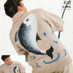 May include: A beige knitted sweater with a blue and gray fish design. The sweater has a zipper and a collar. The text "Action Knit by Wendy 91-122cm (36-48ins)" is printed on the image.