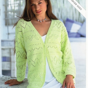 May include: A pale green knitted cardigan with a V-neck and decorative openwork patterns. The long-sleeved garment has a button closure. The image includes the text "Tropicana DK" and "Includes Larger Sizes".