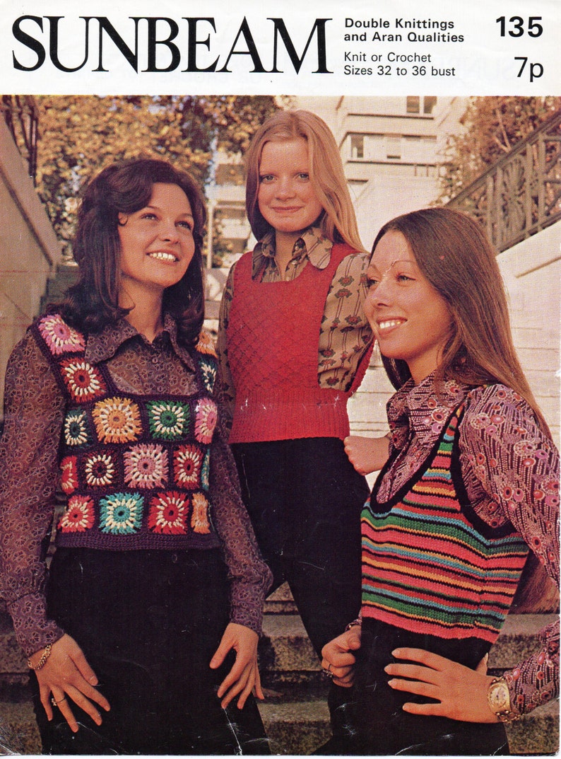 May include: Vintage SUNBEAM magazine cover featuring three women modeling knit and crochet vests. The vests are in various styles, including a colorful striped design and a floral granny square pattern. The cover also includes text about the patterns and sizes.