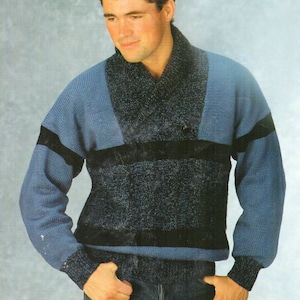 May include: A blue and black striped sweater with a wide, folded collar. The sweater has a sparkly texture.